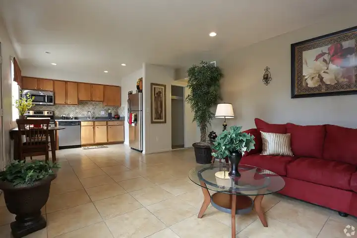 Furnished apartment living area shown — representative home at Camelback Courtyard.